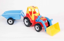 Traktor homlokrakodóval és pótkocsival