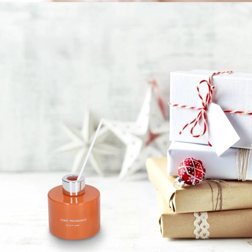 Elegáns diffúzor narancsszínű üvegben