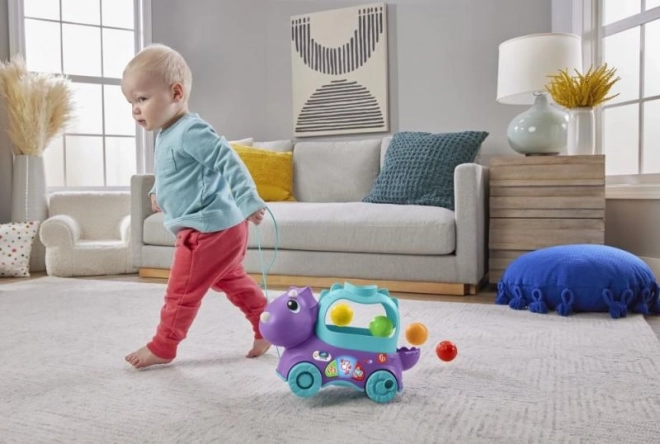 Fisher-Price dínó játék kipattanó golyókkal